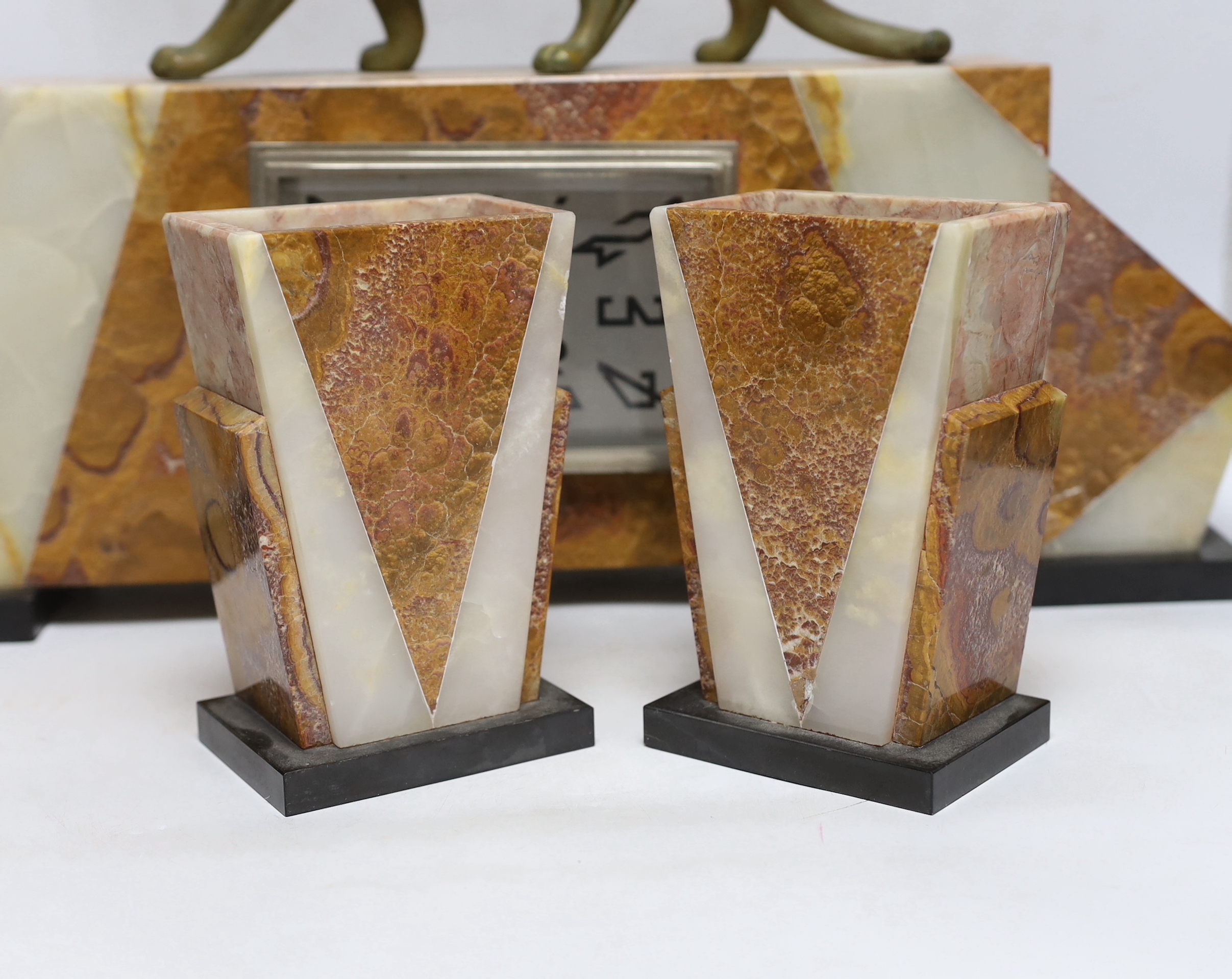 An Art Deco marble clock garniture, 1930’s with ‘panther’ mount